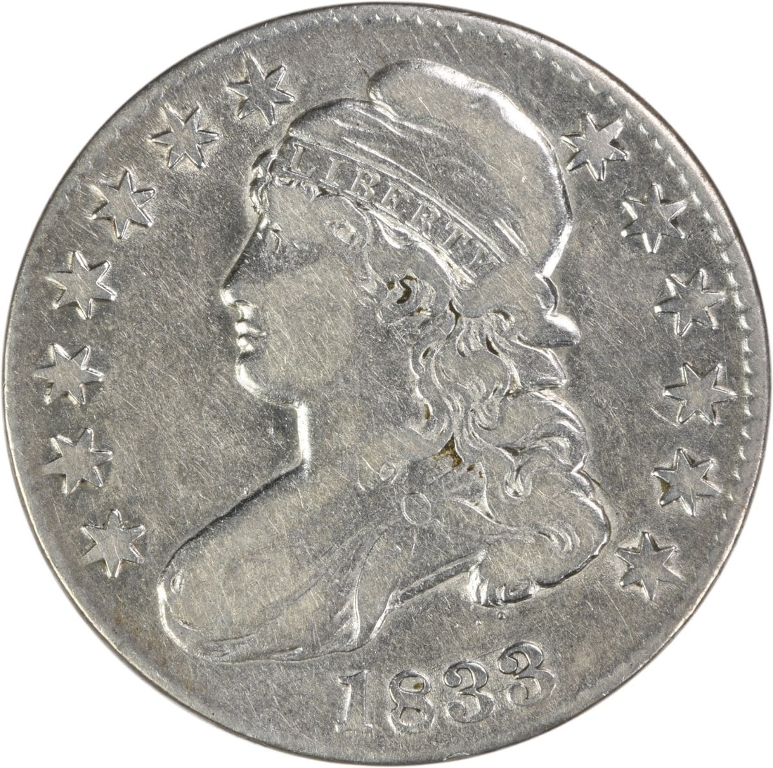 1833 Capped Bust Half Dollar Philadelphia VF Uncertified Silver Coin: 1833 Capped Bust Half Dollar Philadelphia VF Uncertified Silver Coin This 1833 Bust Silver Half Dollar is a circulated coin from the United States, minted in Philadelphia. Designed by John Reich, it f