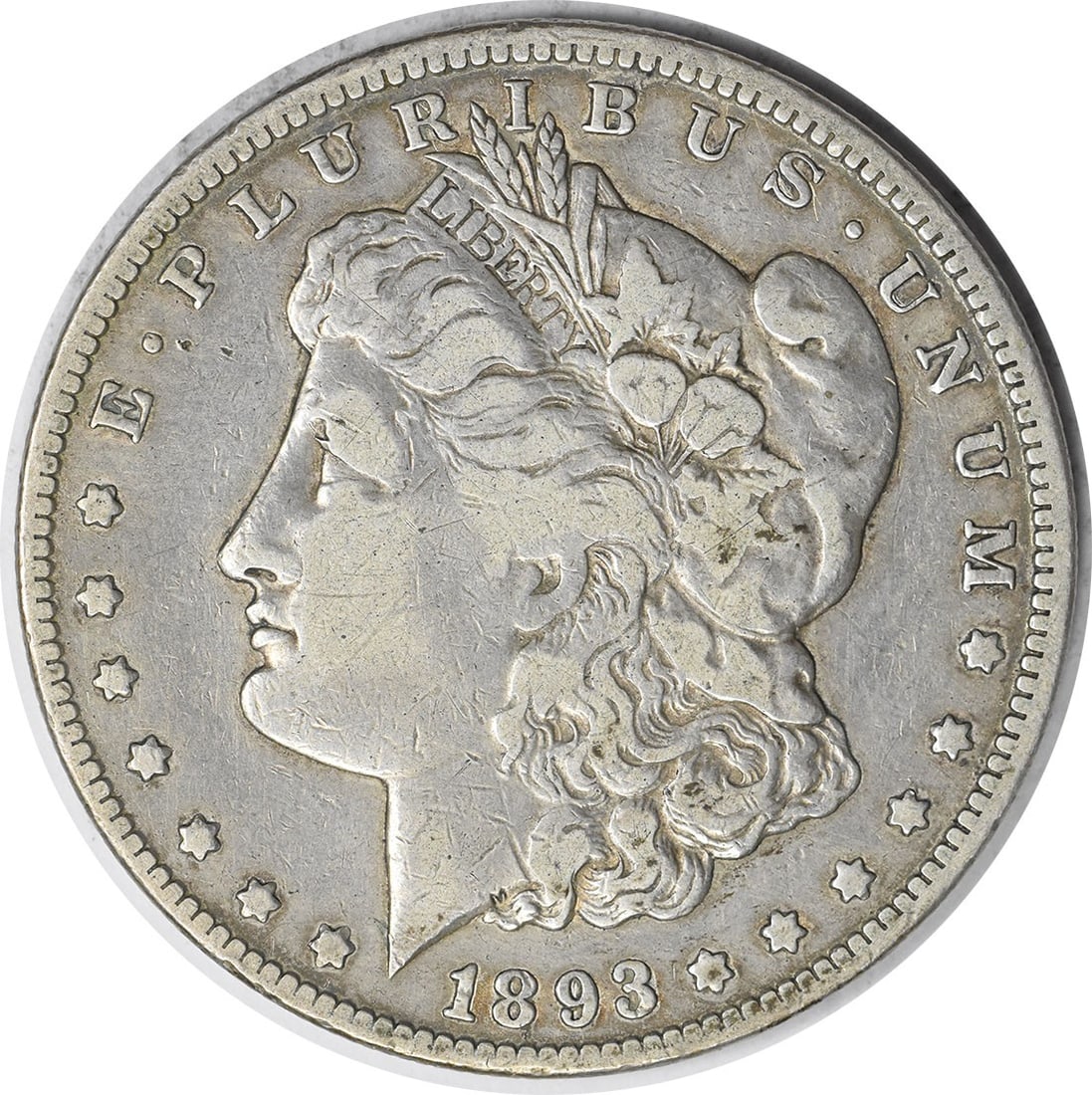VF Grade 1893 Carson City Morgan Silver Dollar Uncertified Coin: VF Grade 1893 Carson City Morgan Silver Dollar Uncertified Coin This 1893-CC Morgan Silver Dollar is a circulated coin minted in Carson City. It features a composition of 90% silver and 10% copper, wi