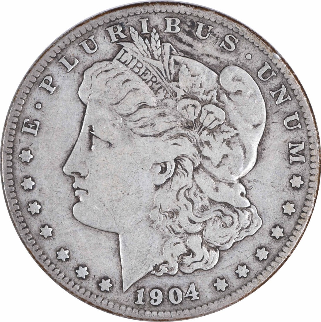 1904-S Morgan Silver Dollar VF Uncertified 90% Silver San Francisco: 1904-S Morgan Silver Dollar VF Uncertified 90% Silver San Francisco This 1904-S Morgan Silver Dollar showcases a vintage design by George T. Morgan, reflecting a rich history and craftsmanship. Struck