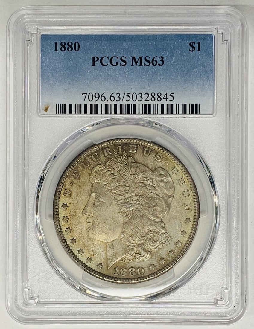PCGS MS 63 1880 Morgan Silver Dollar with Toning: PCGS MS 63 1880 Morgan Silver Dollar with Toning This 1880 Morgan Silver Dollar features attractive toning and has been certified by PCGS with a grade of MS 63. It is an uncirculated coin composed of 