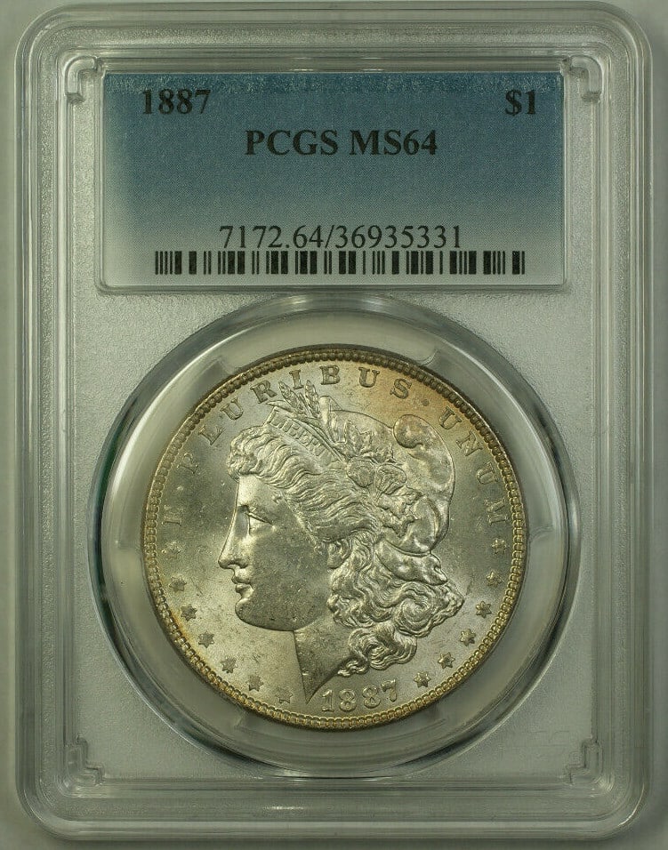 1887 Philadelphia Morgan Dollar Silver Coin PCGS Graded MS-64: 1887 Philadelphia Morgan Dollar Silver Coin PCGS Graded MS-64 This is an 1887 Morgan Silver Dollar $1 coin from the United States, graded MS-64 by PCGS. The coin is composed of silver with a fineness 