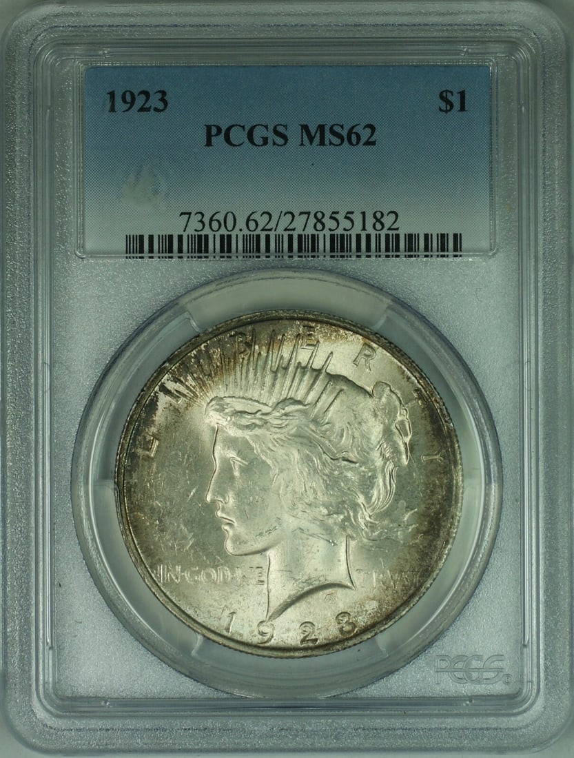 PCGS MS62 1923 Peace Dollar Silver Toned: PCGS MS62 1923 Peace Dollar Silver Toned This is a 1923 Peace Silver Dollar graded MS-62 by PCGS. Struck in silver, this uncirculated coin originates from the United States and was minted in Philadelp