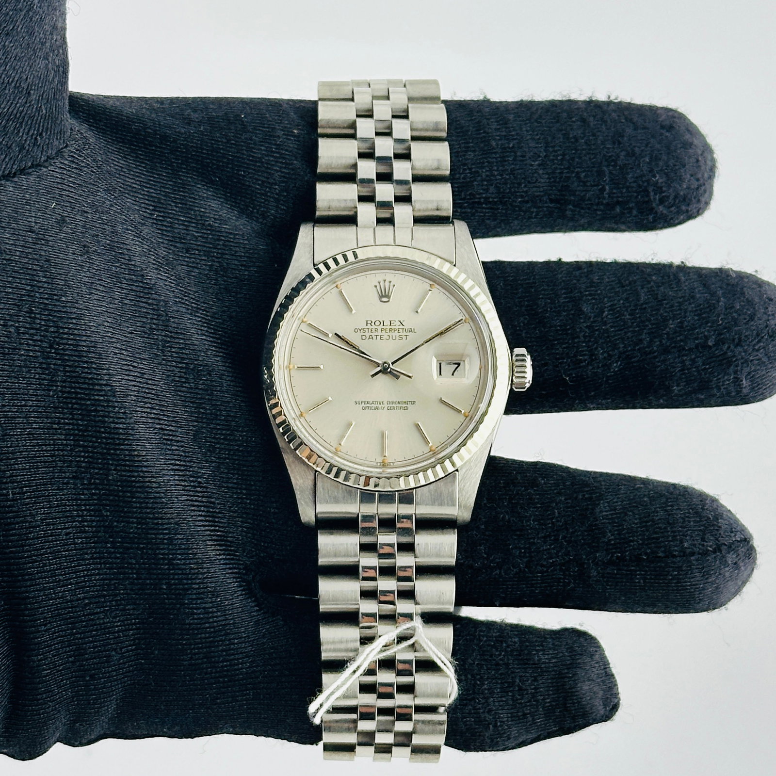 Rolex Datejust 16014 Mens Fluted Bezel Aftermarket Jubilee Bracelet Silver Stick Dial: Rolex Datejust 16014 Mens Fluted Bezel Aftermarket Jubilee Bracelet Silver Stick Dial This men's Rolex Datejust features an aftermarket purple Roman diamond dial, paired with an aftermarket Jubilee br