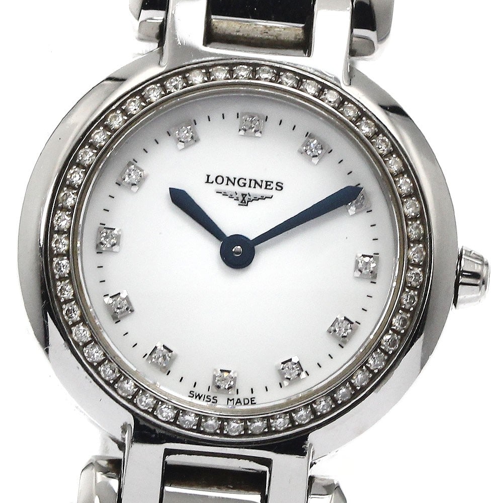 Longines PrimaLuna quartz ladies wristwatch stainless steel: Longines PrimaLuna quartz ladies wristwatch stainless steel This Longines PrimaLuna women's wristwatch features a stainless steel case and bracelet with a white shell dial. It operates on a quartz mov
