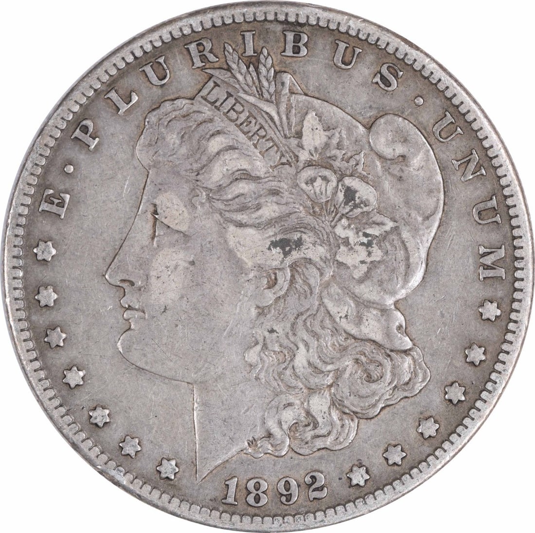 1892-S Morgan Silver Dollar VF Uncertified San Francisco Coin: 1892-S Morgan Silver Dollar VF Uncertified San Francisco Coin This 1892-S Morgan Silver Dollar is a captivating piece of American coinage, featuring a composition of 90% silver and 10% copper. It was 