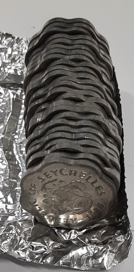 Roll of 25 Uncirculated 1977 Seychelles 5 Cent Aluminum FAO Coins: Roll of 25 Uncirculated 1977 Seychelles 5 Cent Aluminum FAO Coins This roll includes 25 uncirculated 1977 Seychelles 5 Cent coins made of aluminum, featuring the FAO design. The coins are Brilliant Un