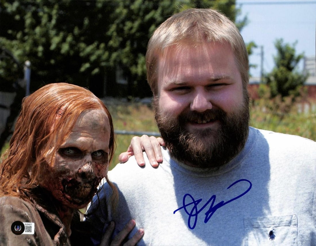 11x14 Beckett authenticated Robert Kirkman Walking Dead signed photo: 11x14 Beckett authenticated Robert Kirkman Walking Dead signed photo This 11x14 color photograph features a vivid image of Robert Kirkman, the creator of The Walking Dead, alongside a walker character