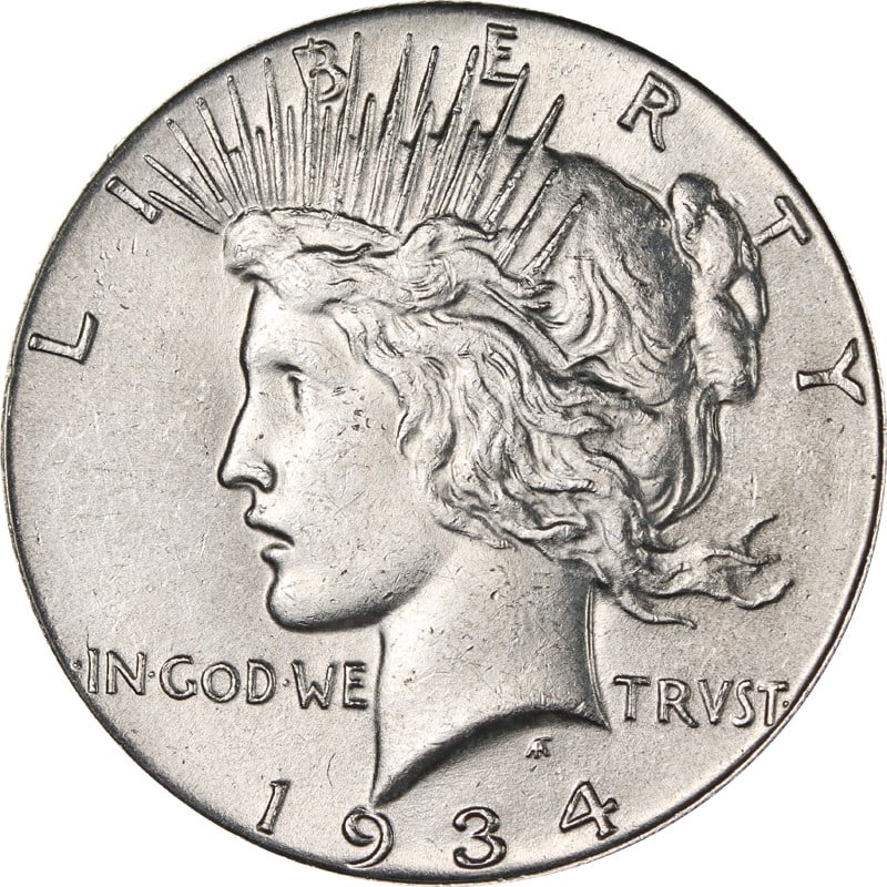 1934 Silver Peace Dollar Coin Philadelphia Mint United States: 1934 Silver Peace Dollar Coin Philadelphia Mint United States This is a 1934-P Peace Dollar minted in the United States. The coin is composed of silver with a fineness of 0.9 and has been circulated. 