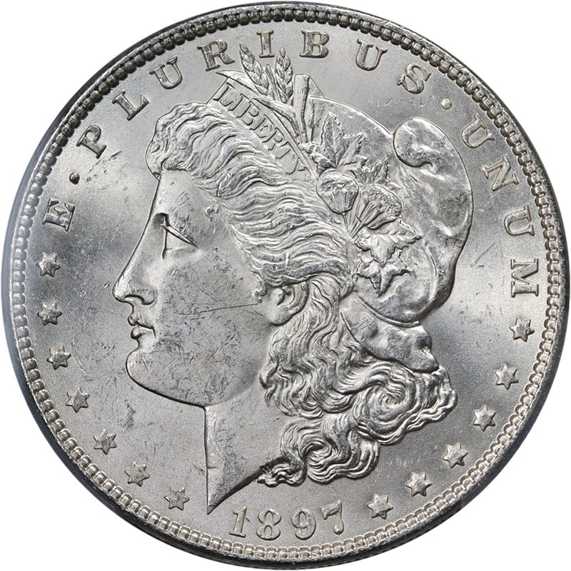 PCGS MS63 1897-P Morgan Dollar Uncirculated Silver Coin: PCGS MS63 1897-P Morgan Dollar Uncirculated Silver Coin This 1897-P Morgan Silver Dollar is graded MS63 by PCGS, featuring a blast white appearance with strong strike and excellent luster. It is compo