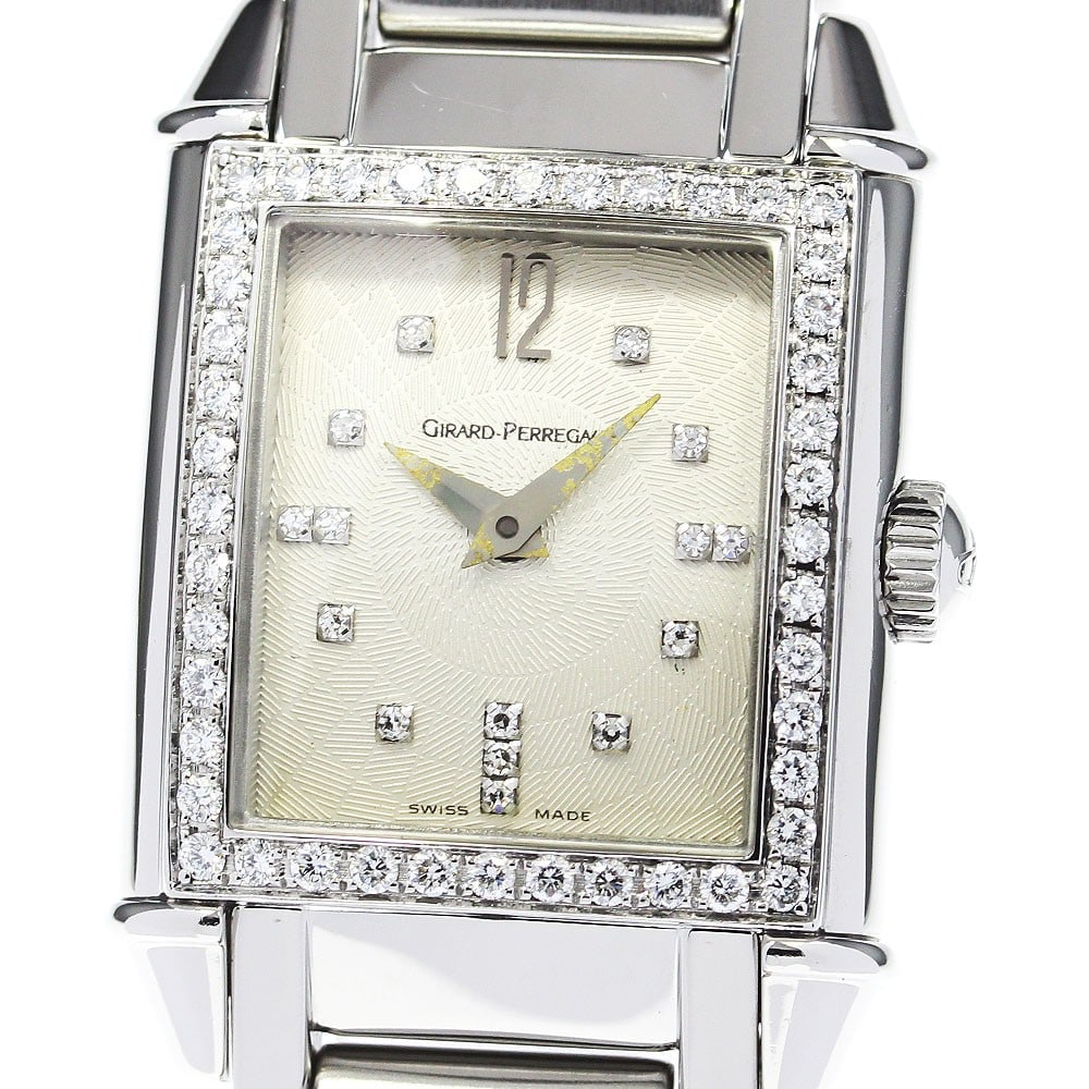 Girard Perregaux Vintage Quartz Womens Steel Wristwatch 25911: Girard Perregaux Vintage Quartz Womens Steel Wristwatch 25911 This Girard Perregaux 25911 Vintage Quartz women's wristwatch features a stainless steel case and bracelet with a silver dial. The watch i