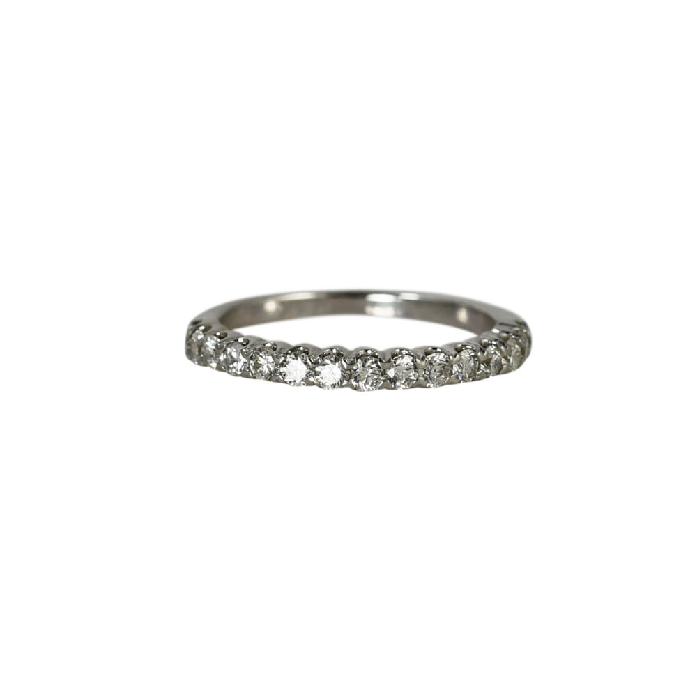 14K White Gold Prong Set Diamond Ring Size 5.5 15 Stones: 14K White Gold Prong Set Diamond Ring Size 5.5 15 Stones This elegant band ring is crafted from 14K white gold and features 15 round diamonds in a prong setting, totaling 0.45 carats. The diamonds hav
