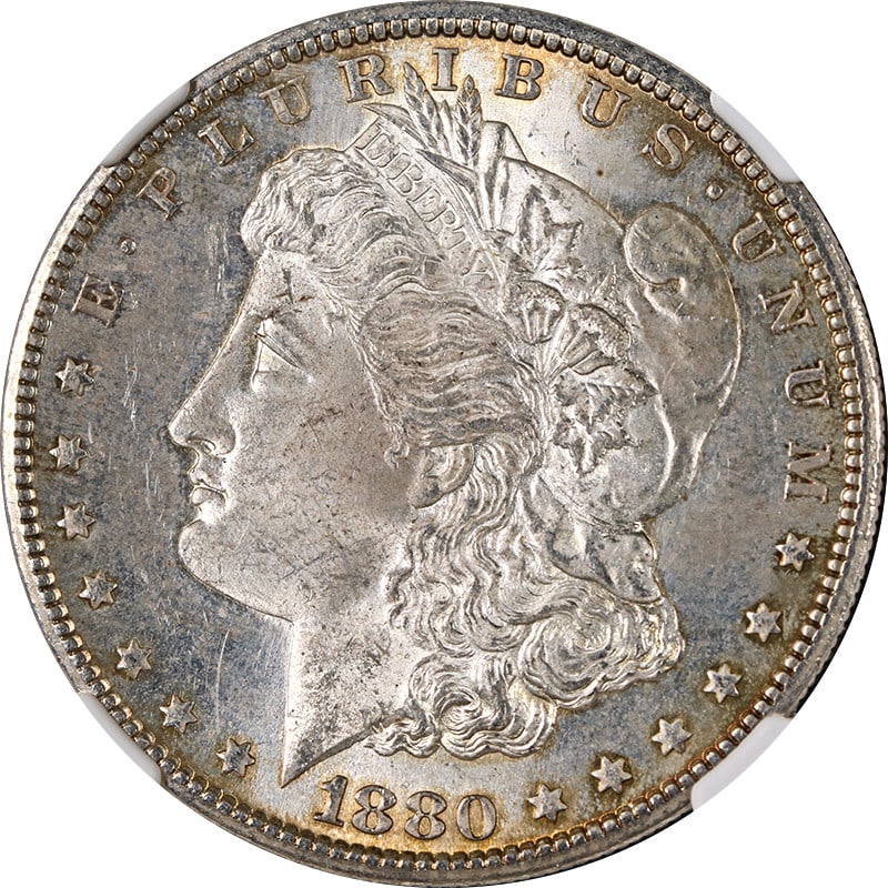 NGC MS63 1880-S Morgan Dollar with Attractive Toning: NGC MS63 1880-S Morgan Dollar with Attractive Toning This 1880-S Morgan Silver Dollar is certified by NGC with a grade of MS63. The coin is composed of silver with a fineness of 0.9 and was minted in 