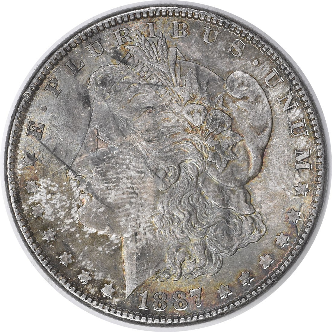 Choice BU 1887 Silver Morgan Dollar Uncertified Toned No Mint Mark: Choice BU 1887 Silver Morgan Dollar Uncertified Toned No Mint Mark This 1887 Morgan Silver Dollar features a beautiful toned appearance and is in Choice Brilliant Uncirculated condition. It is uncerti