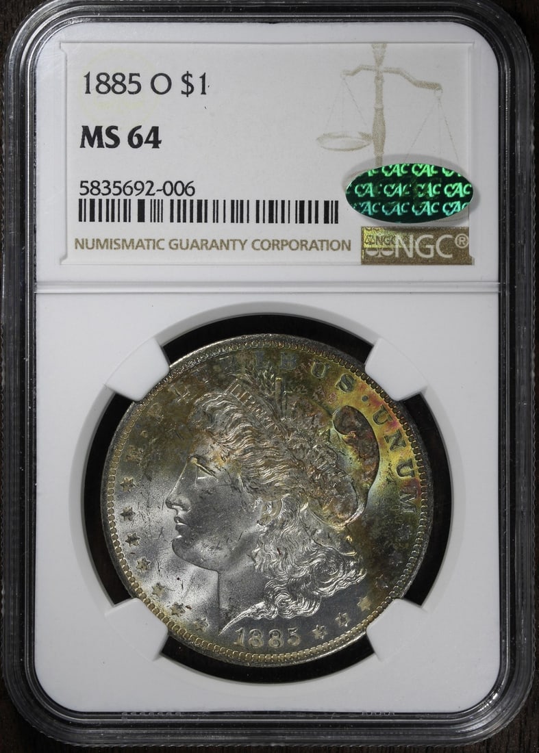 1885-O Morgan Silver Dollar MS64 NGC Rainbow Toned Coin: 1885-O Morgan Silver Dollar MS64 NGC Rainbow Toned Coin This stunning 1885-O Morgan Silver Dollar is graded MS64 by NGC and features beautiful rainbow toning. Minted in New Orleans, this uncirculated 