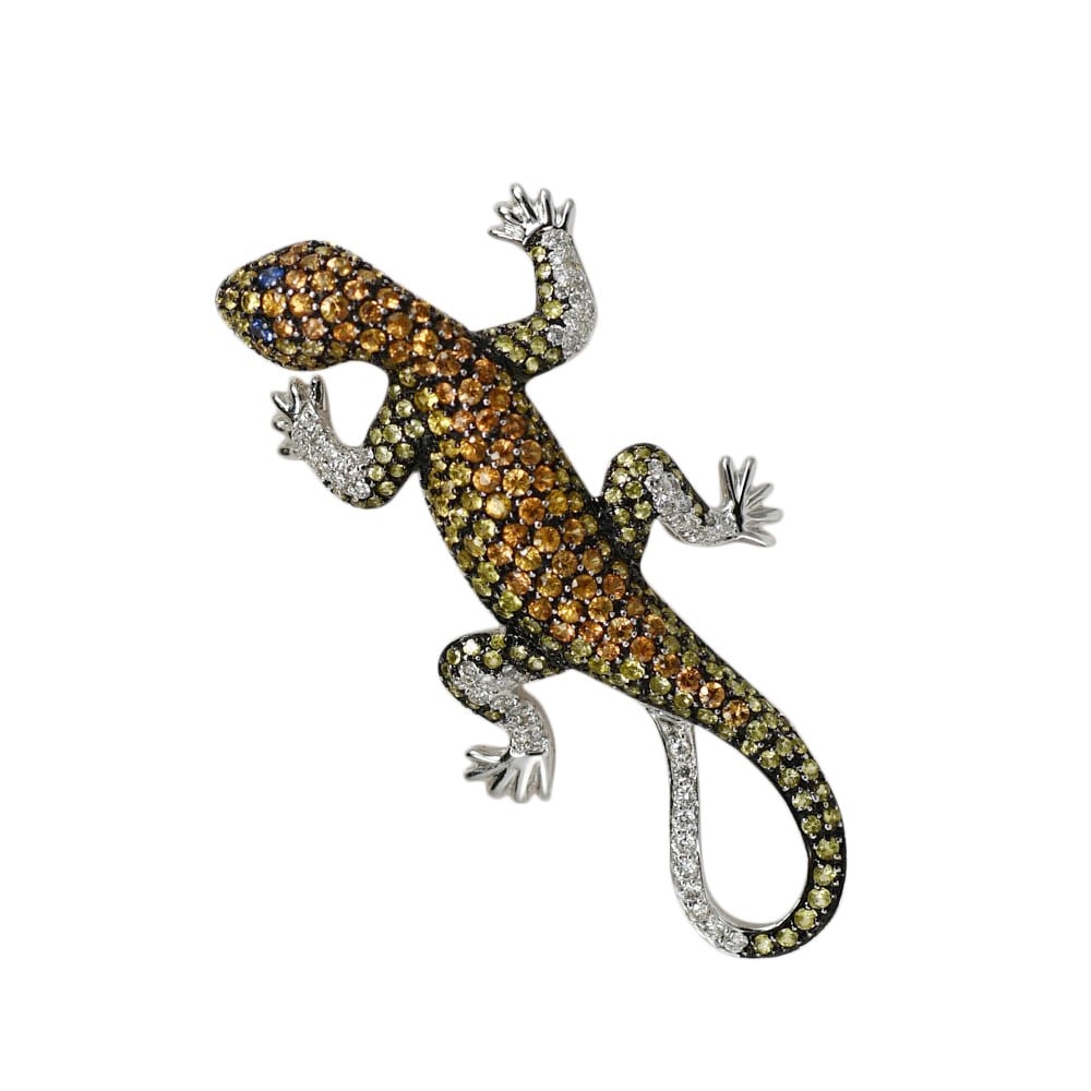 Vintage 18K White Gold Lizard Brooch with Sapphires and Diamonds: Vintage 18K White Gold Lizard Brooch with Sapphires and Diamonds This vintage brooch is custom made from 18k white gold and features a lizard (chameleon) design. The body is adorned with round brillia