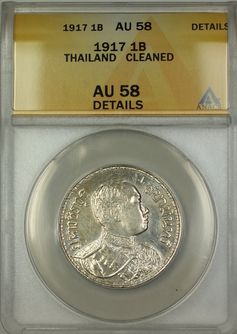Thailand 1917 Silver 1 Baht Coin ANACS AU 58 Details Certified: Thailand 1917 Silver 1 Baht Coin ANACS AU 58 Details Certified This 1917 Thailand 1 Baht silver coin is certified by ANACS with a grade of AU-58 Details and a notation of cleaning. The coin originates