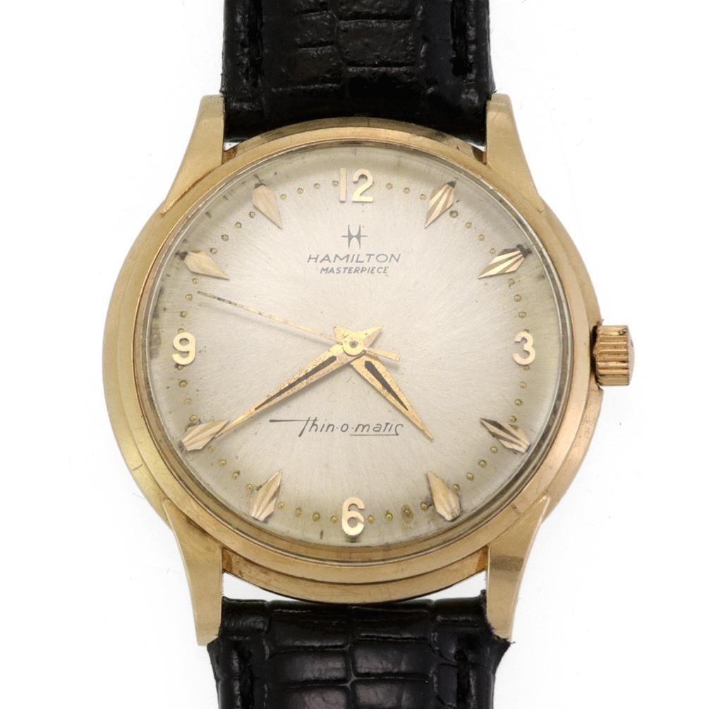 Hamilton Masterpiece Thin-O-Matic 14k Gold Men's Watch with Leather Band: Hamilton Masterpiece Thin-O-Matic 14k Gold Men's Watch with Leather Band This exquisite vintage Hamilton Masterpiece Thin-O-Matic men's wristwatch features a stunning 14k yellow gold case with a round