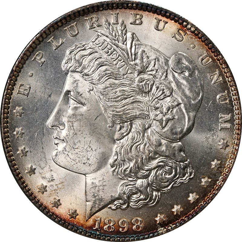 1898 Philadelphia Morgan Dollar NGC MS64 Silver: 1898 Philadelphia Morgan Dollar NGC MS64 Silver This 1898-P Morgan Silver Dollar has been graded MS64 by NGC, indicating a high-quality uncirculated coin. It features attractive peripheral toning and 