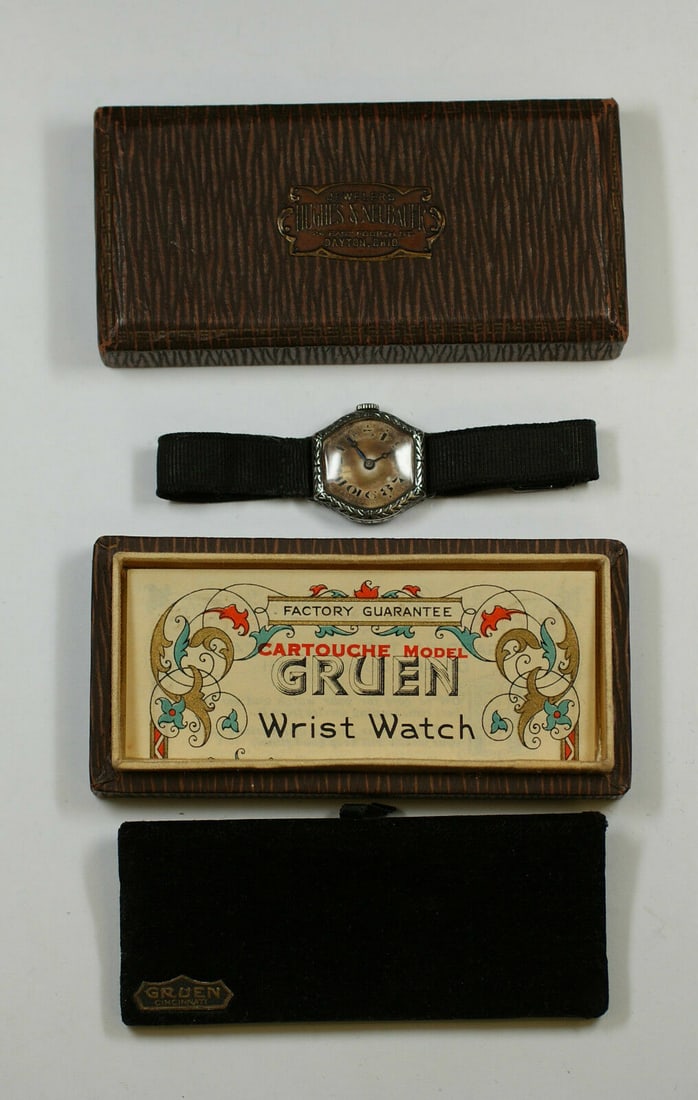 Sterling Silver Antique Gruen Wristwatch with Cartouche Design and Original Box: Sterling Silver Antique Gruen Wristwatch with Cartouche Design and Original Box This antique Gruen wristwatch features a sterling silver cartouche design and comes in its original box. Manufactured in