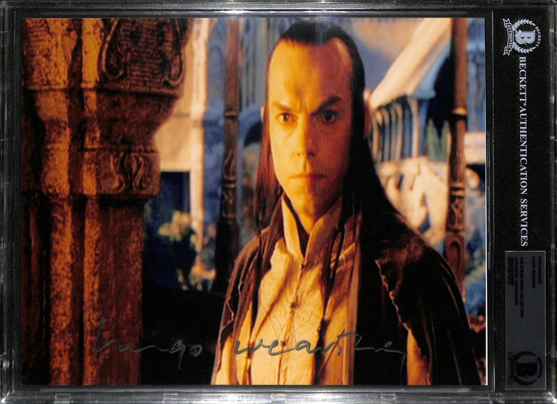 Beckett Slabbed Hugo Weaving Lord of the Rings 8x10 Signed Photo: Beckett Slabbed Hugo Weaving Lord of the Rings 8x10 Signed Photo This is a signed 8x10 photograph of Hugo Weaving, featuring his portrayal from the Lord of the Rings film series. The autograph has bee