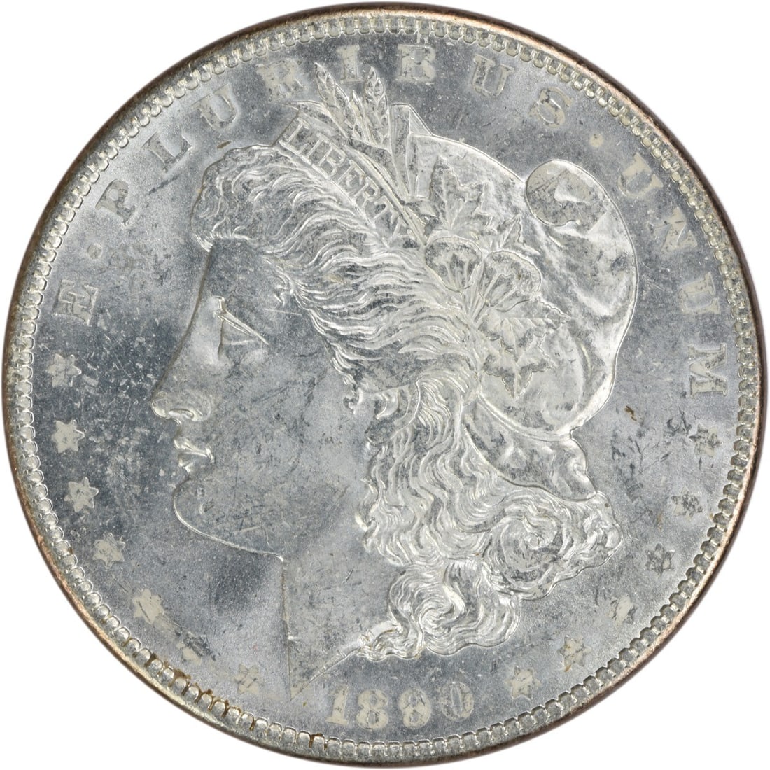 Uncirculated 1890 Silver Dollar Morgan Type Brilliant Uncertified Example: Uncirculated 1890 Silver Dollar Morgan Type Brilliant Uncertified Example This is an uncirculated 1890 Morgan Silver Dollar from the United States. The coin is composed of silver, features no mint mar