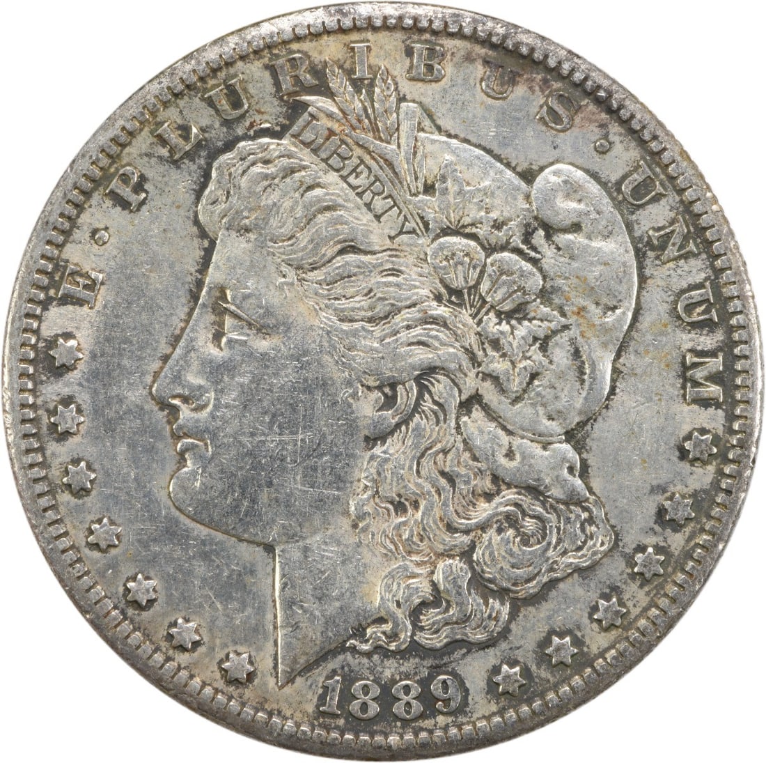 AU Grade San Francisco 1889 Morgan Silver Dollar Uncertified Coin: AU Grade San Francisco 1889 Morgan Silver Dollar Uncertified Coin This 1889-S Morgan Silver Dollar is an uncertified, circulated coin struck at the San Francisco Mint. Composed of 90% silver and 10% c