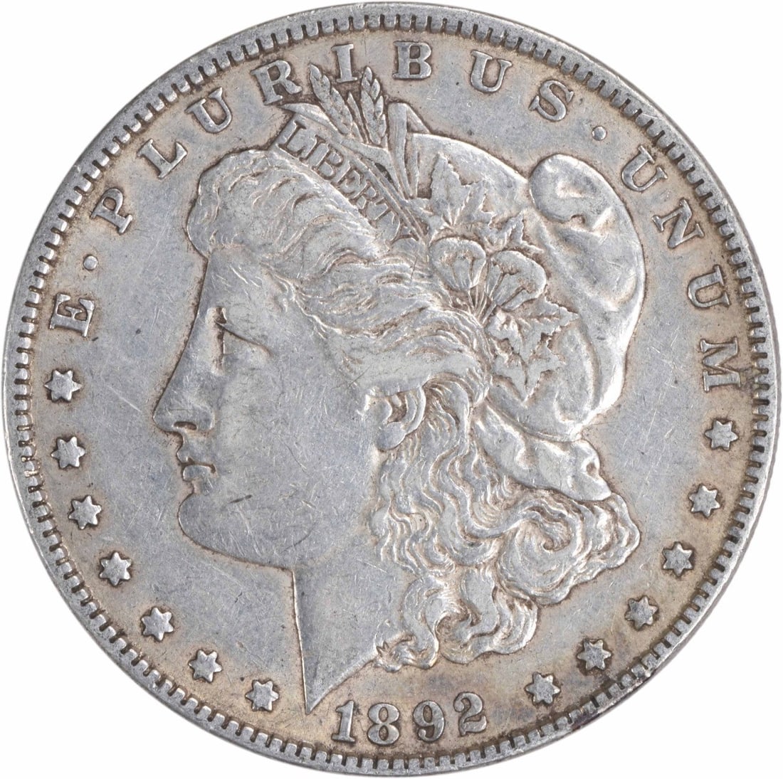 1892 Morgan Silver Dollar Uncertified 90% Silver XF Coin: 1892 Morgan Silver Dollar Uncertified 90% Silver XF Coin This 1892 Morgan Silver Dollar is a remarkable piece of American numismatic history, featuring a striking design by George T. Morgan. The coin 