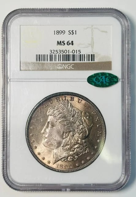 1899 NGC CAC Morgan dollar MS-64 silver: 1899 NGC CAC Morgan dollar MS-64 silver This 1899 Morgan Silver Dollar has been graded MS-64 by NGC and is further certified by CAC. Struck in silver, this coin originates from the USA and is in pre-o