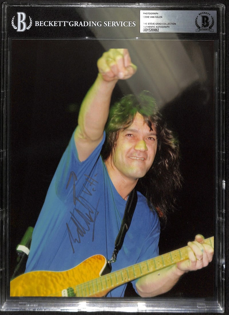 Beckett Slabbed Eddie Van Halen Autographed 8x10 Photograph: Beckett Slabbed Eddie Van Halen Autographed 8x10 Photograph This is an 8x10 photograph hand-signed by Eddie Van Halen, the legendary guitarist and co-founder of Van Halen. The autograph has been authe
