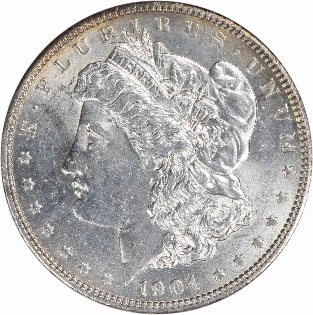 Uncirculated 1904 Morgan Dollar Silver Coin Brilliant Uncertified: Uncirculated 1904 Morgan Dollar Silver Coin Brilliant Uncertified This is a 1904 Morgan Silver Dollar from the United States, featuring a bright uncirculated (BU) condition. The coin is composed of