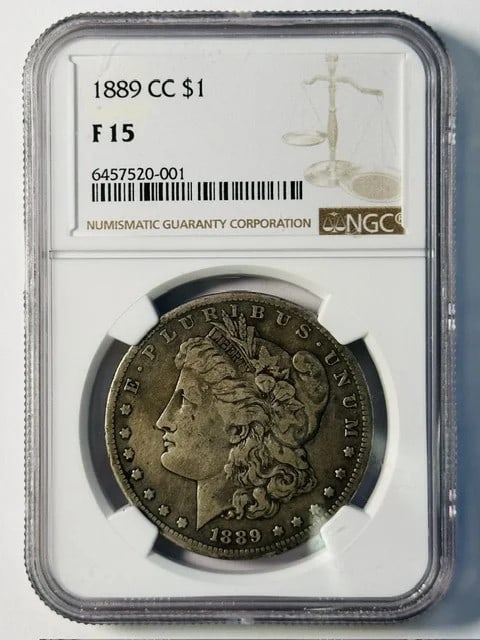 Carson City 1889 CC Morgan Dollar NGC F15 Silver: Carson City 1889 CC Morgan Dollar NGC F15 Silver This 1889 Carson City Morgan Silver Dollar is certified by NGC with a grade of F 15. Struck at the Carson City Mint, this pre-owned coin is composed of