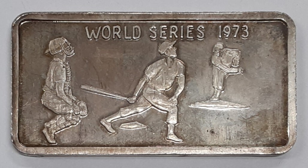 1973 World Series Commemorative MGC 1 Troy Oz 999 Silver Bar: 1973 World Series Commemorative MGC 1 Troy Oz 999 Silver Bar This vintage MGC .999 silver bar commemorates the 1973 World Series. Crafted in the United States with a high silver fineness of 0.999, it 