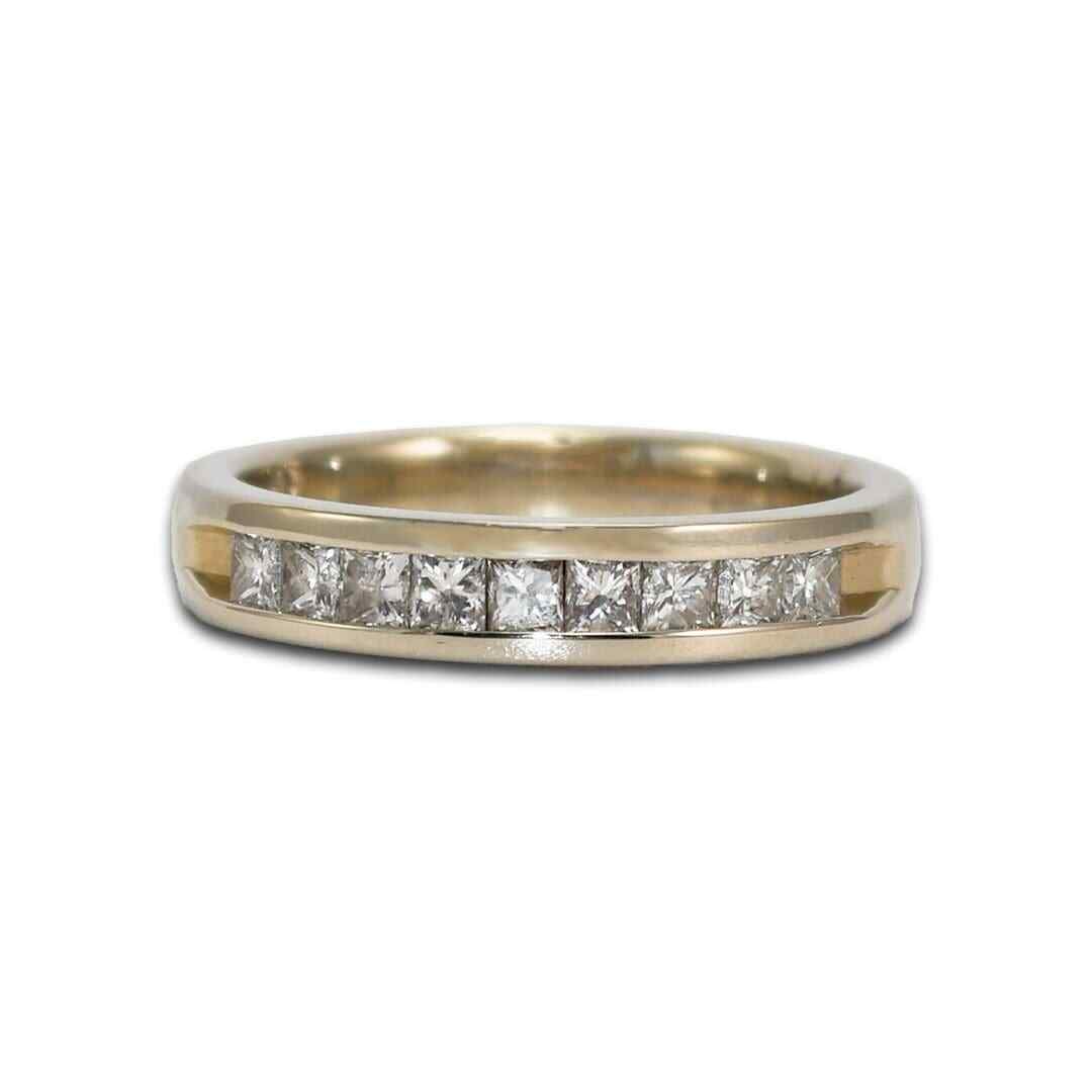Princess Cut Diamond Channel Set Ring 14K White Gold Size 7: Princess Cut Diamond Channel Set Ring 14K White Gold Size 7 This elegant ring features a 14k white gold band adorned with nine princess cut diamonds, totaling 0.50 carats. The diamonds have SI clarity