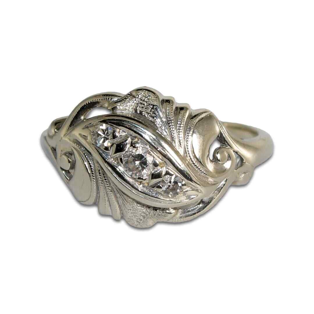 Antique 14K White Gold Cocktail Ring with 3 Diamonds Size 7: Antique 14K White Gold Cocktail Ring with 3 Diamonds Size 7 This antique cocktail-style ring is crafted from 14-karat white gold and features three round brilliant diamonds set in a pave setting with 