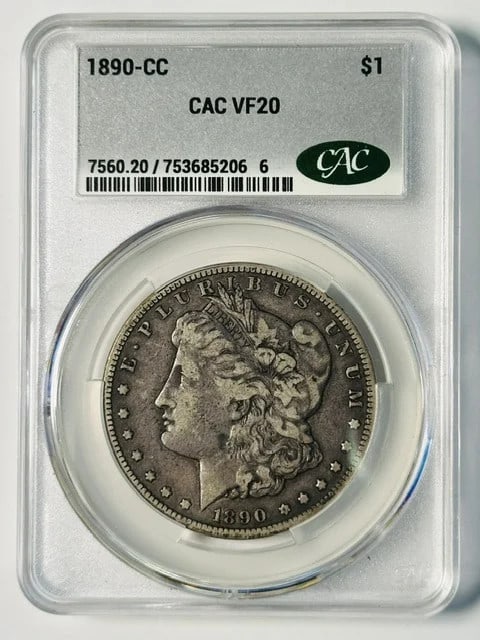 1890-CC Carson City Morgan Dollar CAC VF 20 Silver Coin: 1890-CC Carson City Morgan Dollar CAC VF 20 Silver Coin 1890-CC Morgan Silver Dollar certified by CAC and graded VF 20. This pre-owned coin was minted in Carson City and is a U.S. dollar denomination 