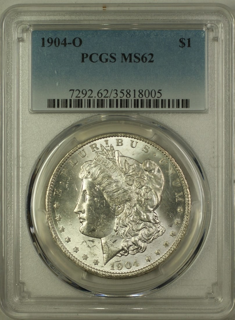 PCGS MS62 1904-O Morgan Dollar Silver Coin: PCGS MS62 1904-O Morgan Dollar Silver Coin This is a 1904-O Morgan Silver Dollar with a $1 denomination, minted in New Orleans. The coin is composed of silver and has been graded MS-62 by PCGS, indica