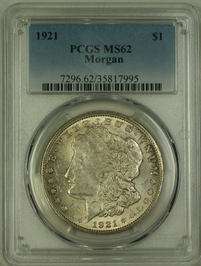 PCGS MS62 1921 Morgan Dollar Silver Coin With Toning: PCGS MS62 1921 Morgan Dollar Silver Coin With Toning This 1921 Morgan Silver Dollar features a $1 denomination and is graded MS-62 by PCGS. The coin is composed of silver, minted in Philadelphia, and 
