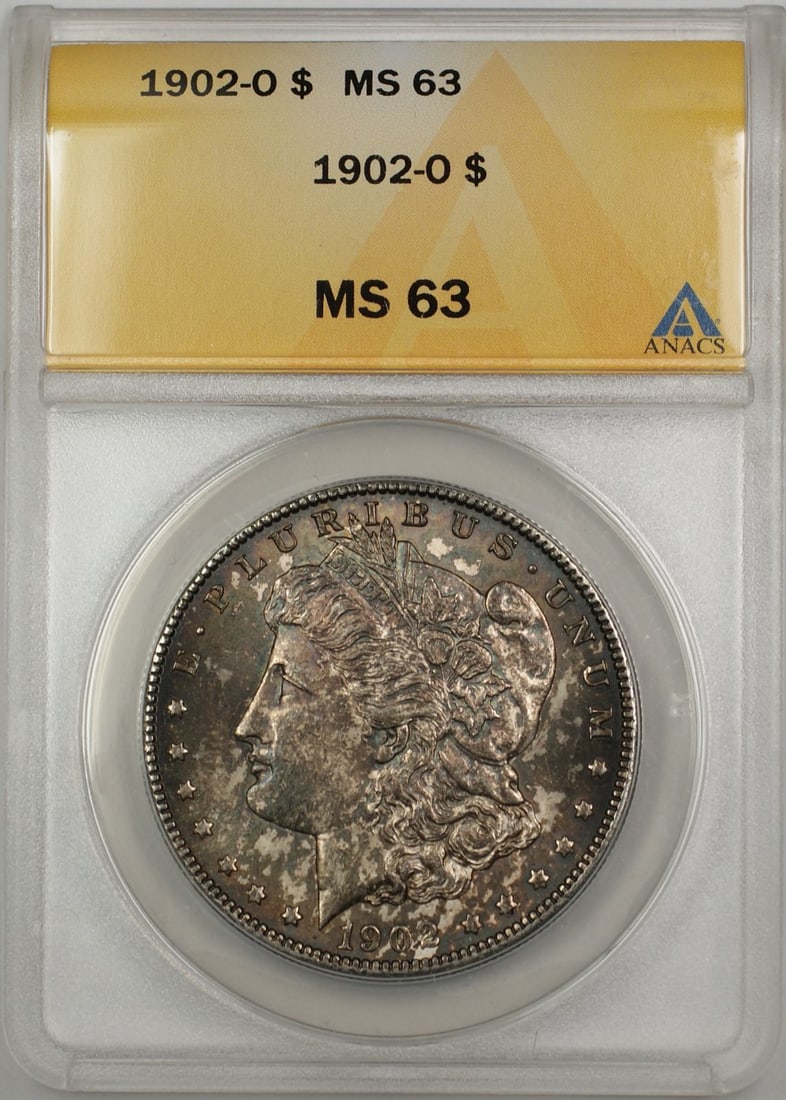 ANACS MS 63 1902-O Morgan Silver Dollar Toned: ANACS MS 63 1902-O Morgan Silver Dollar Toned This 1902-O Morgan Silver Dollar is a collectible coin from the United States, minted in New Orleans. It is composed of silver and has been graded MS 63 b