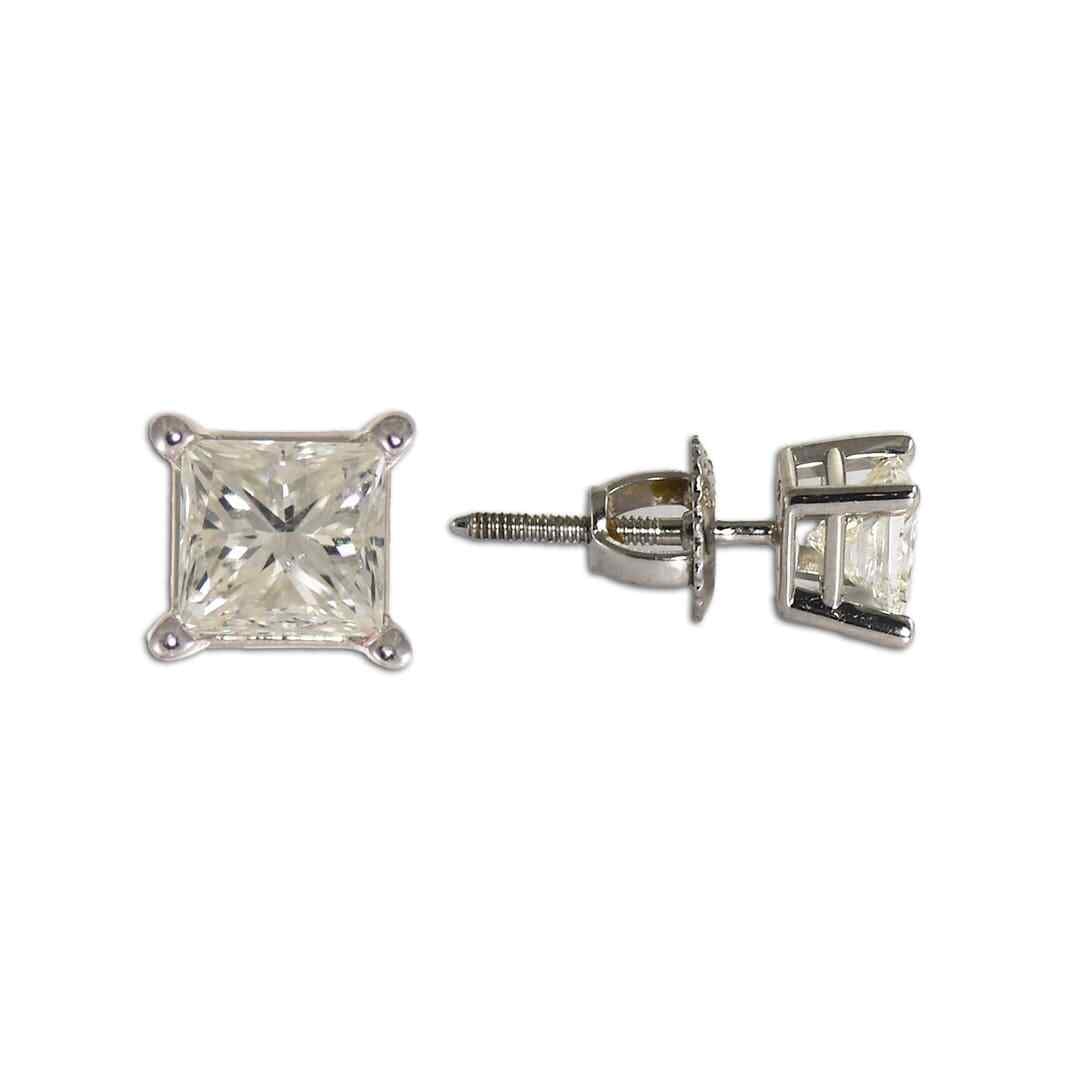 Princess Cut Diamond Stud Earrings in 14k White Gold: Princess Cut Diamond Stud Earrings in 14k White Gold These stud earrings feature princess cut diamonds set in 14k white gold. The diamonds have a total carat weight ranging from 1.00 to 1.24 carats, w