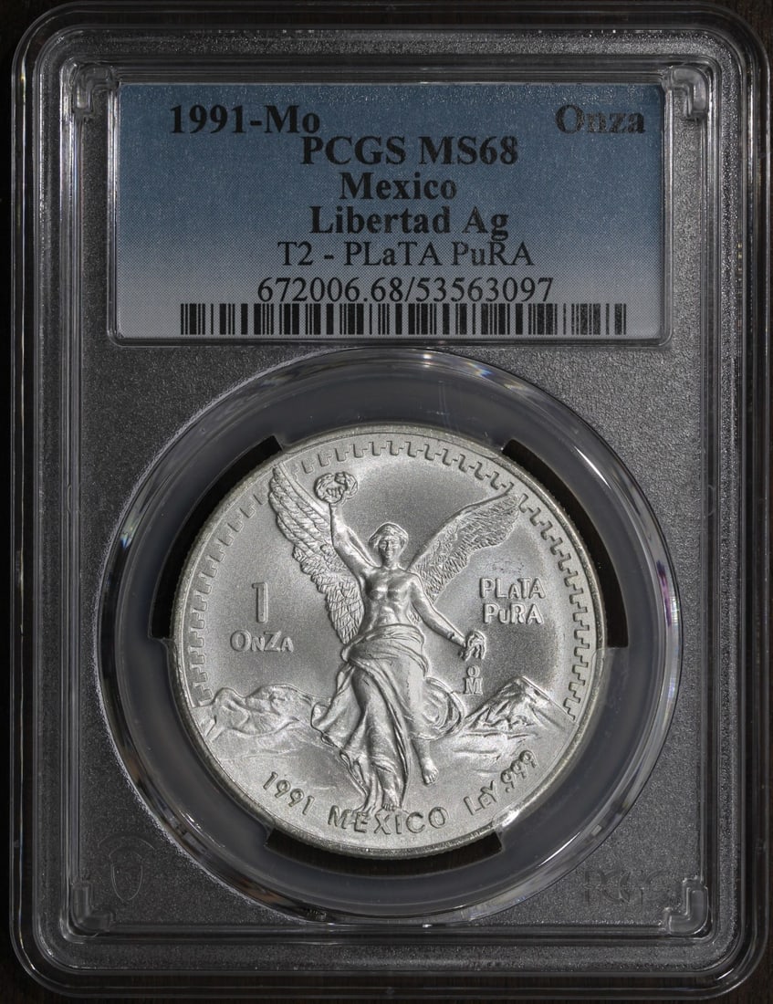 PCGS MS68 1991-Mo Mexico 1 oz Silver Libertad Type 2: PCGS MS68 1991-Mo Mexico 1 oz Silver Libertad Type 2 This 1991-Mo Type 2 Mexico 1 oz Silver Libertad Onza is a key date collectible coin. Struck from .999 fine silver, it contains 1 troy ounce of prec