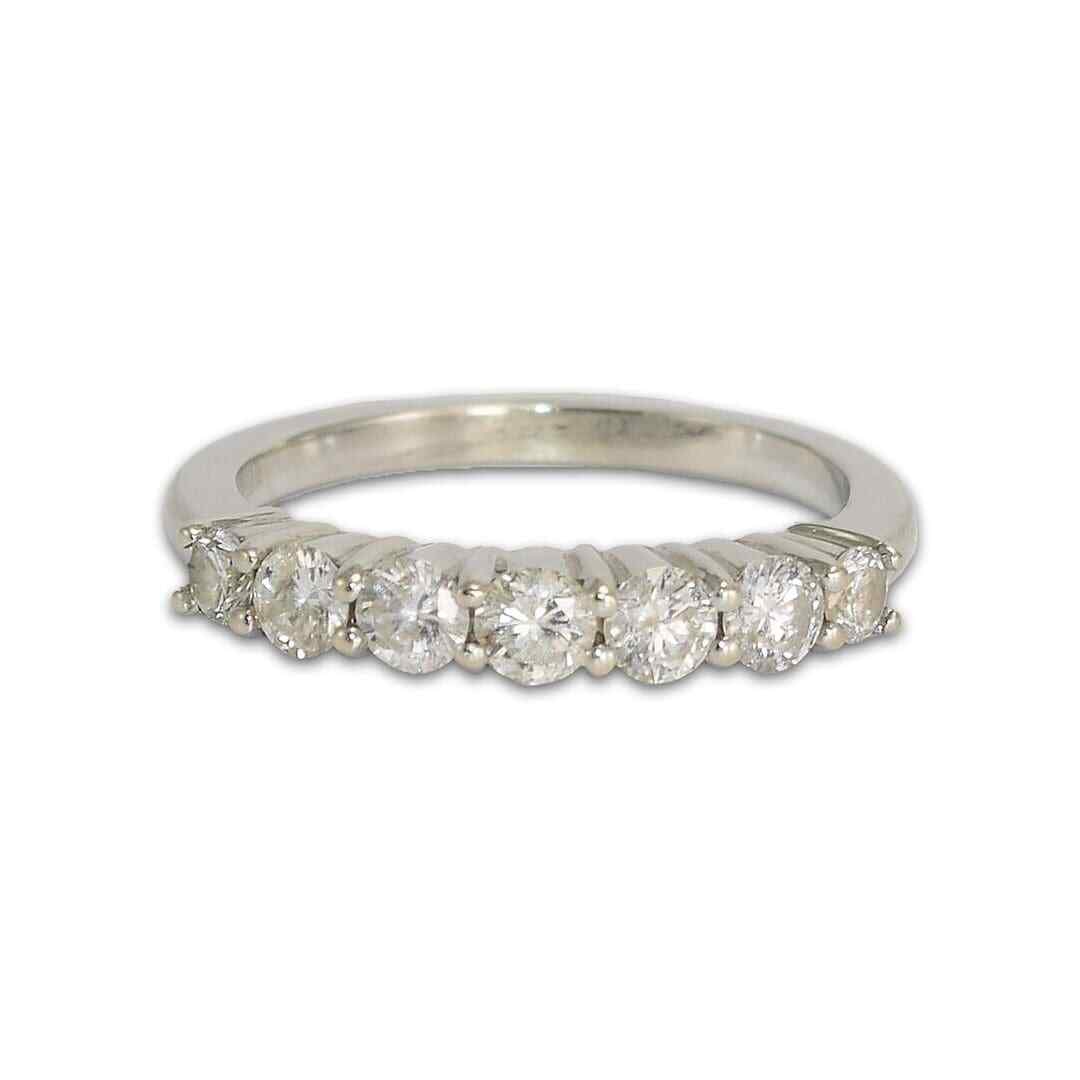 14K White Gold 7-Diamond Wedding Band Size 6.75: 14K White Gold 7-Diamond Wedding Band Size 6.75 This elegant engagement or anniversary band is crafted from 14k white gold and features seven round brilliant cut diamonds with a total carat weight of 
