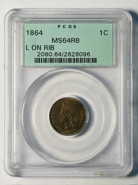 1864 Philadelphia Indian Head Cent PCGS MS64 RB OGH: 1864 Philadelphia Indian Head Cent PCGS MS64 RB OGH This 1864 Indian Head Penny was minted in Philadelphia and is composed of copper. Graded MS-64 RB by PCGS, it features the 'L on Ribbon' variety and