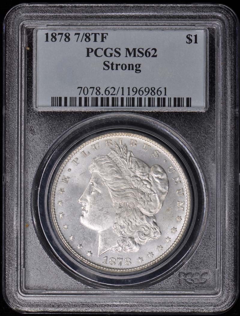 1878 Morgan Dollar PCGS MS62 Uncirculated Philadelphia Mint: 1878 Morgan Dollar PCGS MS62 Uncirculated Philadelphia Mint This 1878 Morgan Dollar is a remarkable piece of numismatic history. Graded MS62 by PCGS, this uncirculated coin showcases the stunning arti