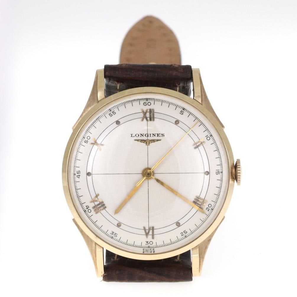 Longines 14k Yellow Gold Men's Hand-Wind Watch with Black Leather Band: Longines 14k Yellow Gold Men's Hand-Wind Watch with Black Leather Band This exquisite Longines men's wristwatch is a timeless piece crafted from authentic 14k yellow gold. The polished case features a