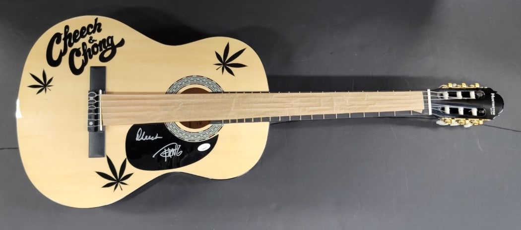 Cheech & Chong Signed Acoustic Guitar JSA Certified Authentic: Cheech & Chong Signed Acoustic Guitar JSA Certified Authentic This is an authentic acoustic guitar hand-signed by the iconic comedy duo Cheech Marin and Tommy Chong. The signature has been verified by
