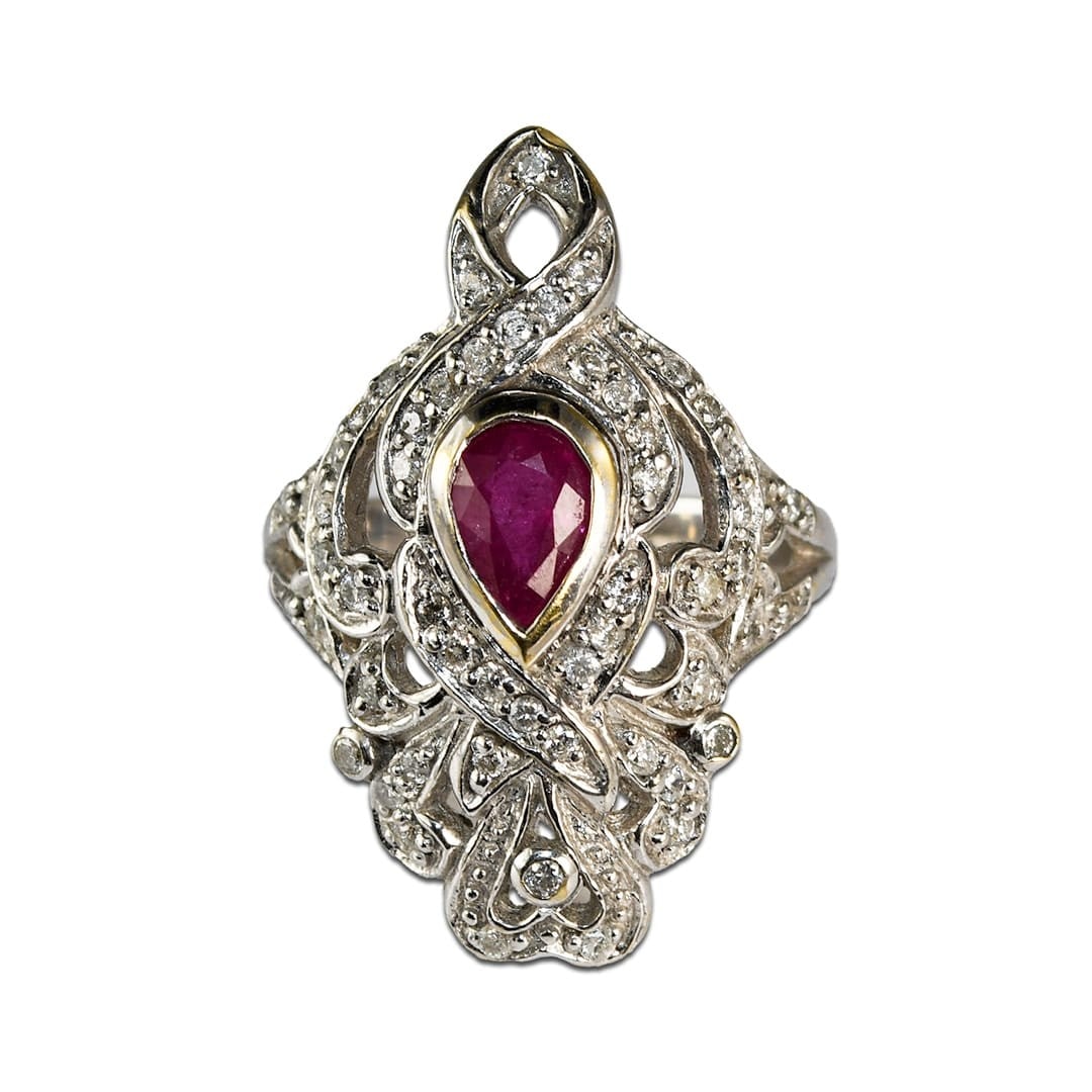 Art Deco 14K White Gold Ring with Ruby and 50 Diamonds: Art Deco 14K White Gold Ring with Ruby and 50 Diamonds This Art Deco ring is crafted from 14k white gold and features a pear-shaped natural ruby as the center stone, measuring 6 x 4 millimeters and we
