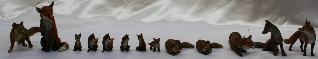 1900s 13 Piece Austrian Bronze Fox Collection: 1900s 13 Piece Austrian Bronze Fox Collection This exquisite collection features 13 pieces of Austrian bronze fox sculptures from the 1900s, showcasing remarkable detail, design, and a beautiful patin