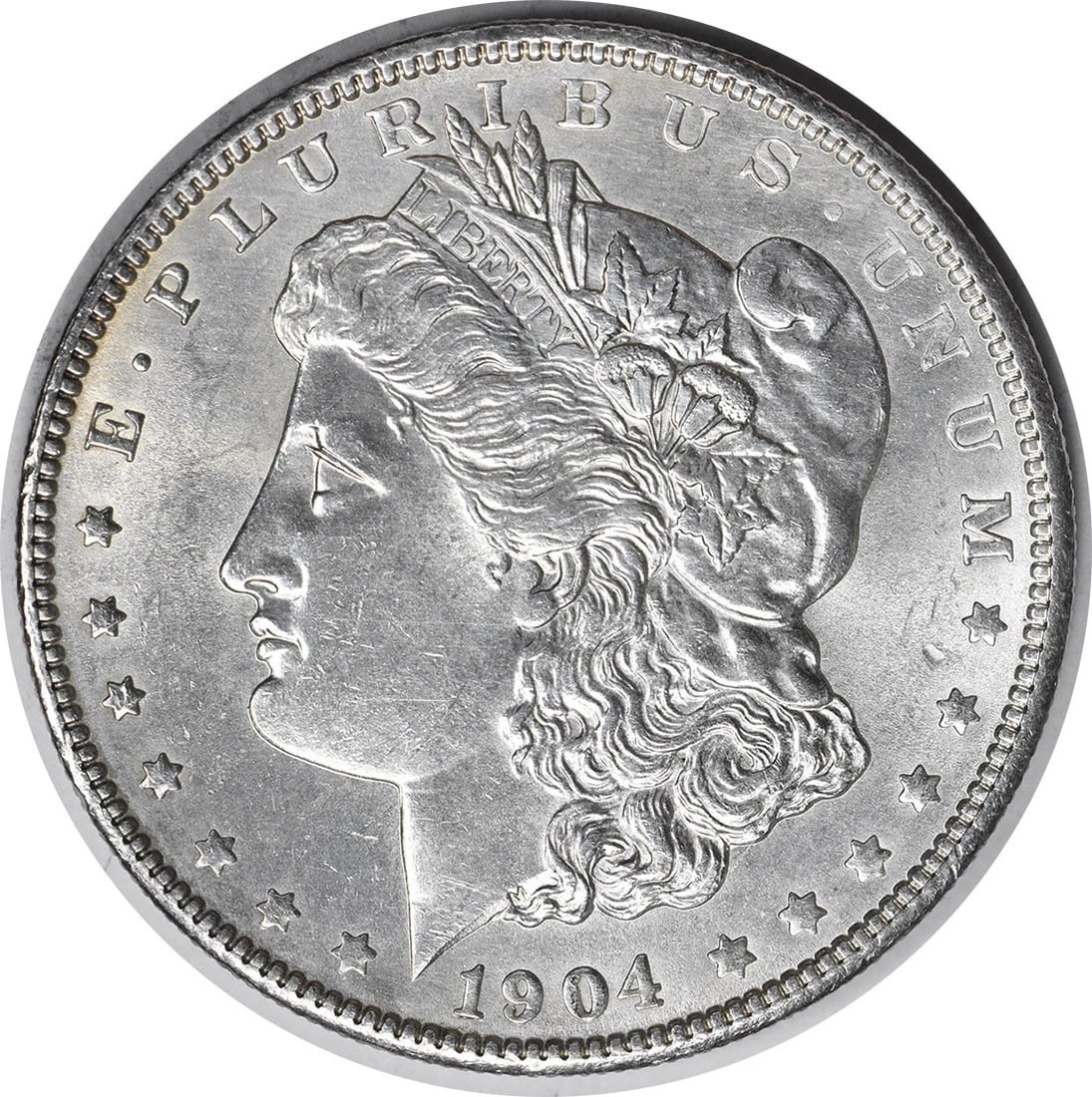 1904 Silver Dollar Morgan Coin Choice BU Uncertified No Mint Mark: 1904 Silver Dollar Morgan Coin Choice BU Uncertified No Mint Mark This 1904 Morgan Silver Dollar is an uncirculated coin graded as Choice BU. It is composed of silver and was minted in the United Stat