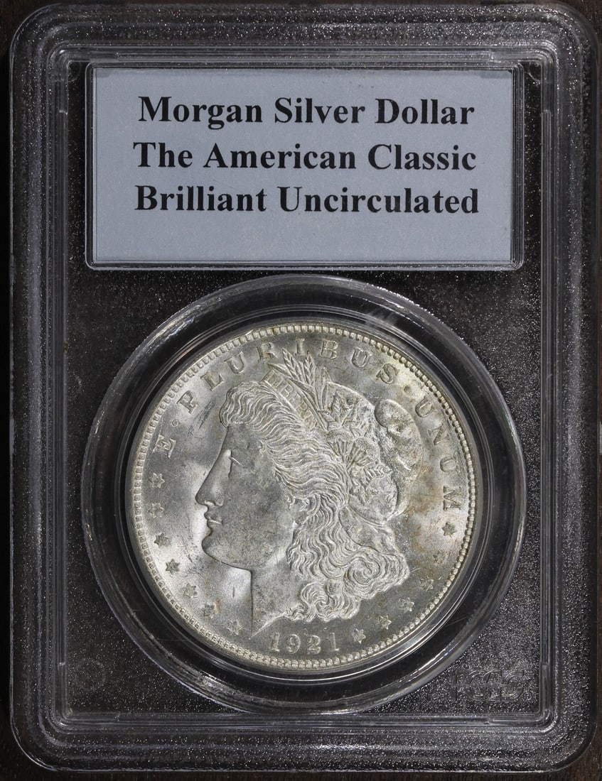 PCGS 1921-D Morgan Silver Dollar Brilliant Uncirculated: PCGS 1921-D Morgan Silver Dollar Brilliant Uncirculated This 1921-D Morgan Silver Dollar is a classic American coin, featuring a composition of 90% silver. Graded as uncirculated and certified by PCGS