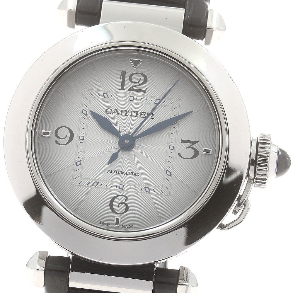 Cartier WSPA0012 Pasha automatic wristwatch steel silver dial leather strap: Cartier WSPA0012 Pasha automatic wristwatch steel silver dial leather strap Pre-owned Cartier Pasha WSPA0012 automatic wristwatch with a stainless steel case, silver dial, and leather strap. This unis